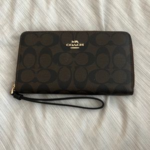 Used black and brown coach wallet